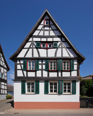 Half-timbered wooden residential house with symmetrical gable in Germany