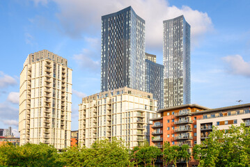 Fototapeta premium Modern apartment blocks and towers in Manchester on a sunny summer day