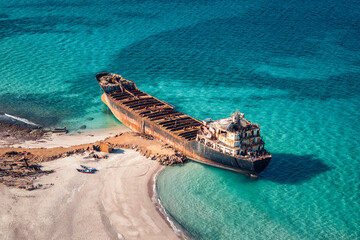 Aerial view of Gulf Dove omani rusty ship wreck with turquoise water of Arabian Sea, Delisha beach...