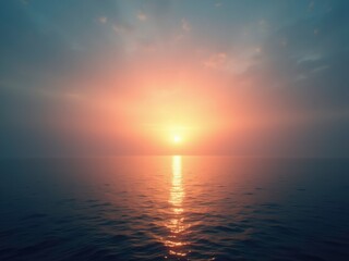 Obraz premium A serene sunset over a mountain range, with the sun dipping below the peaks, casting a warm glow over the landscape.