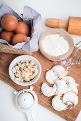 kue putri salju or princess snow cookies or snow white cookies is melt in the mouth cookies has a shape of crescent coated in icing sugar and popular indonesian cookies for lebaran. selected focus