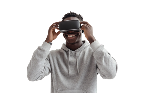 Smiling young man in a gray hoodie adjusting his VR headset with a confident expression. The soft white background enhances the modern and tech-focused vibe.

 - Powered by Adobe