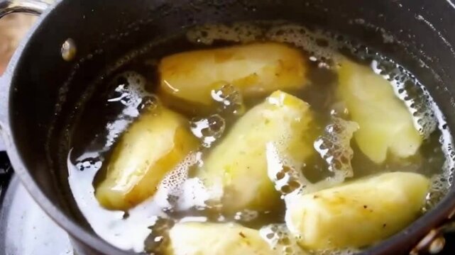 Boiling potatoes froth herbs glide