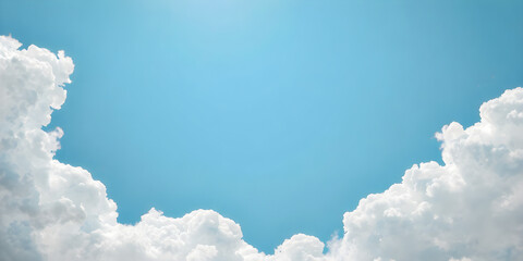 A bright, clear sky with soft, fluffy clouds gently arranged around the edges of the image