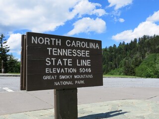 Female Legs Crossed Wearing Flip Flops Relaxing in Kitchen Cafe