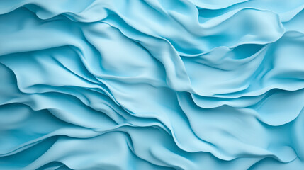 Obraz premium Soft blue fabric texture with flowing waves, ideal for backgrounds and designs. gentle curves create calming and serene atmosphere, perfect for various creative projects