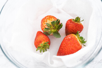 Washed and Dried Strawberries Neatly Stored in a Glass Bowl