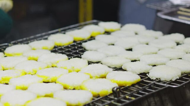 Street food Thailand culture, Grilled sticky rice dipped in egg or Khao jee on the grill&mdash;this type of food is commonly eaten by rural Thai people.