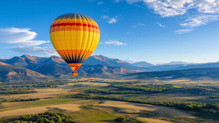 Obraz premium vibrant hot air balloon soaring over scenic mountains