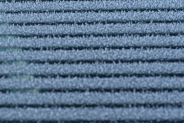 Car windshield defrosting and leaving a striped pattern in the frost (Macro)