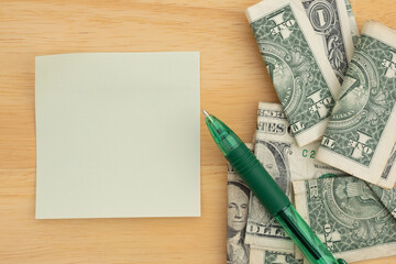 Financial Planning with sticky notes and cash