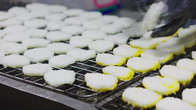 Street food Thailand culture, Grilled sticky rice dipped in egg or Khao jee on the grill&mdash;this type of food is commonly eaten by rural Thai people.