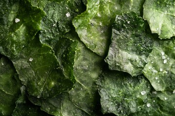 Close-up of vibrant green mineral texture with natural crystals