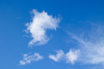 Photograph of white clouds on a white background. Concept: Nature, wind, clouds.