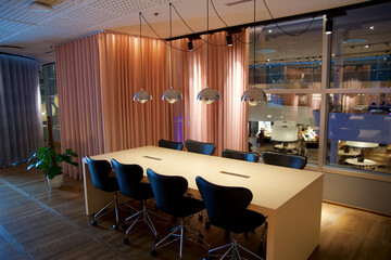 Copenhagen, Denmark, November 24, 2018: Spacious Work Area with a Large Table and Eight Seats, Featuring Power Outlets in the Frequent Flyer Lounge
