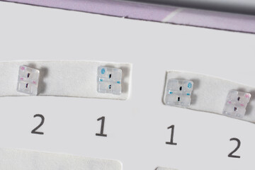 White unused ceramic braces close-up, orthodontics.