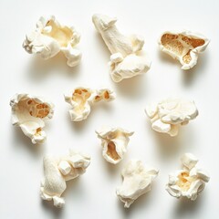 Fototapeta premium close-up of popped popcorn kernels on a white background