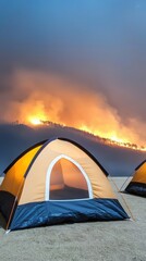A poignant photograph of displaced families setting up tents near a wildfire evacuation zone