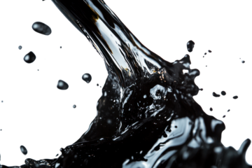 Plastic bottle releasing dark engine oil in mid-pour, forming splashes and droplets in different shapes and sizes