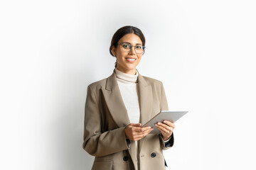 Young indian or arabic woman in business holding digital computer, looking at camera. Portrait of middle eastern Israel businesswoman using tablet pc online app for work isolated on white background.