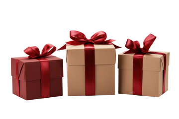 Obraz premium Three gift boxes of different shapes arranged in a row, each tied with a red ribbon and bow.