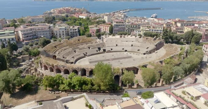 Aerial view of the Flavian Amphitheater, located in Pozzuoli, near Naples. It is the third-largest Roman amphitheater in Italy. It was built by the same architects who constructed the Roman Colosseum.