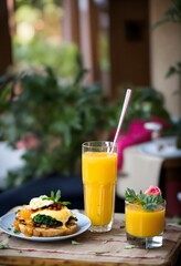Fototapeta premium glass of orange juice and breakfast heart eating concept 