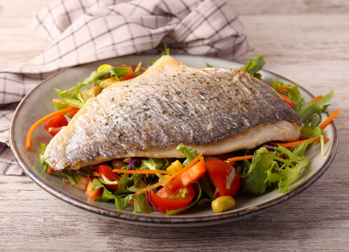Fried sea bream with salad