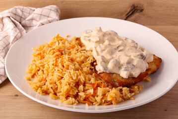 Carrot rice with fried turkey fillet
