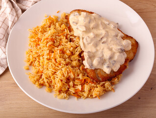Carrot rice with fried turkey fillet