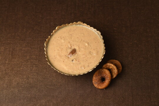 Anjeer basundi in bowl with anjeer (fig) on brown colour baground