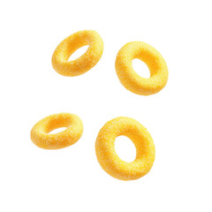 Crispy Golden Rings: Delicious Snack Food Photography, Four Yellow Rings Falling Against Black Background
