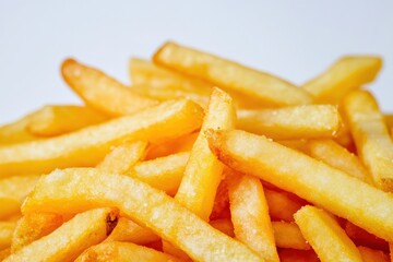 a pile of french fries on a white background