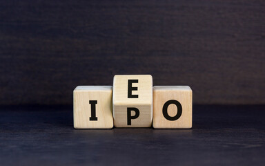 Initial public or exchange offering symbol. Concept words abbreviation IPO IEO on wooden block....