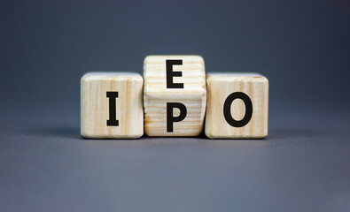 Initial public or exchange offering symbol. Concept words abbreviation IPO IEO on wooden block....