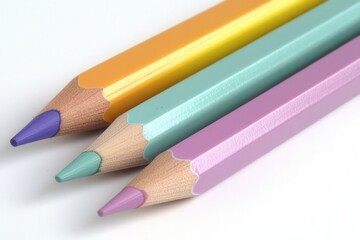 Naklejka premium close-up of three colored pencils on a white background
