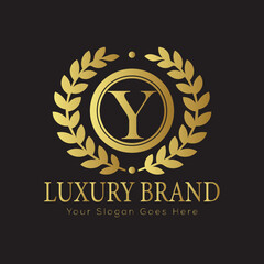 Letter Luxury brand logo design with a royal gold crown emblem and elegant typography
