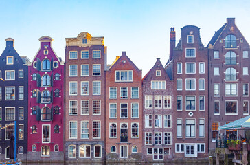 Colourful houses of central Amsterdam among a canal.