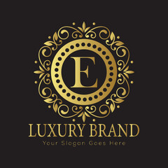 Letter Luxury brand logo design with a royal gold crown emblem and elegant typography
