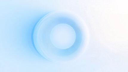 A glowing white circular shape with soft blue gradients on a minimalist background creating a sleek abstract geometric effect
