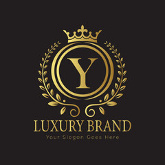 Letter Luxury brand logo design with a royal gold crown emblem and elegant typography
