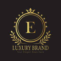 Letter Luxury brand logo design with a royal gold crown emblem and elegant typography
