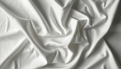 Obraz premium Background with soft white fabric in gentle folds, creating beautiful textures and shadows. The fabric appears smooth and luminous, capturing light in a subtle way.