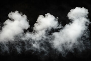 Obraz premium A group of white smoke rising from a black background, suitable for representing a mysterious or futuristic atmosphere