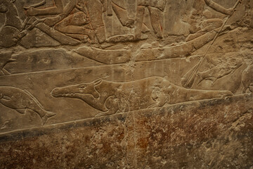Egyptian hieroglyphs and paintings on the walls of Egyptian ancient temples