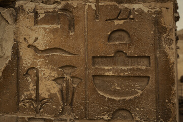 Egyptian hieroglyphs and paintings on the walls of Egyptian ancient temples