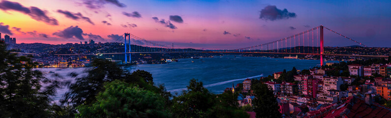 A breathtaking panoramic view of the Bosphorus Bridge in Istanbul at sunset.Istanbul's Bosphorus Bridge at Sunset: A Stunning Panoramic View. Best touristic destination Istanbul, Türkiye