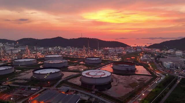 Oil Refinery plant at sunset. Gas Chemical Equipment Prodiction import export Concept, Crude Oil Refinery Plant Steel Pump Pipe line and Chimney and Cooling tower, Chemical Petrochemical