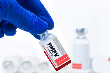 Medical researcher holds HMPV vaccine vial in laboratory setting