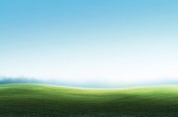 Fototapeta premium Serene landscape misty green field under a clear blue sky.